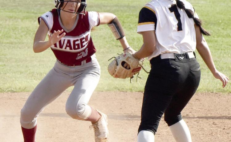 Wynnewood’s Charlee Minton rounds second base in the Lady Savages’ win over Calera, 7-0. News Star photo by Don Coffey