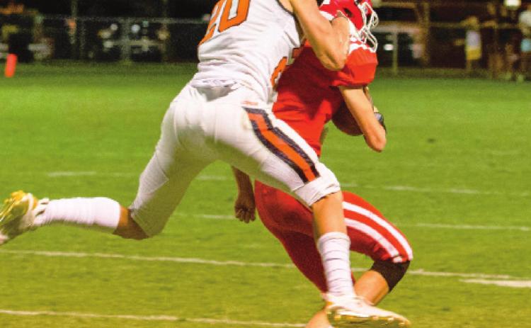 Andon Register tries to break up a pass to the Wolves receiver.